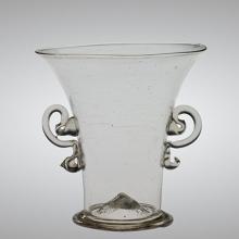 clear vessel with flared top, two ear-shaped handles